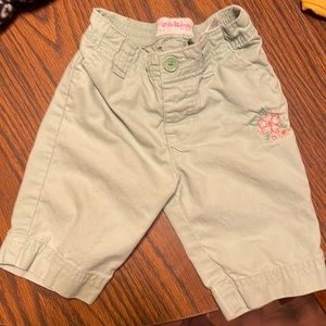 Girls 12 months osh kosh green pants with flower stenciled on left leg